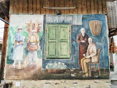 Murale con calzolaio e raccoglitrici di legna